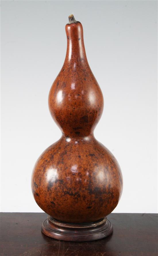 A Chinese gourd and rosewood stand, 19th century, total height 28.5cm